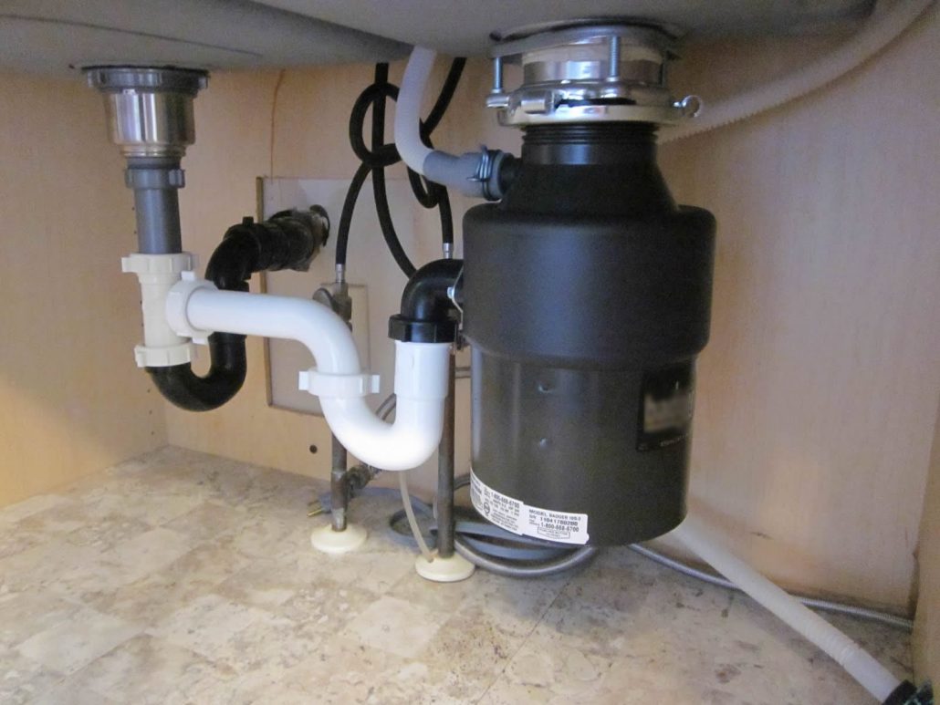 kitchen sink disposal leaking bottom